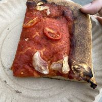Vegan slice with tomato and garlic   at Scarr's Pizza in New York City