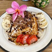 Off-menu dessert - seashell waffle with fresh fruit, granola, and homemade chocolate ice cream. at Tropical Kitchen Cabo in Cabo San Lucas