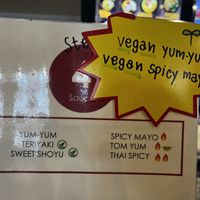 Explaining the sauces.  at Corner 11 Bowl and Wrap in Cleveland