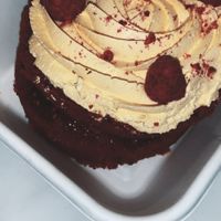 Small cake with passion fruit topping and raspberry jam filling  at Chök in Barcelona