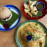 Jackfruit meat burger, deep fried tofu with garlic coriander sauce and chickpea omelet with rice  at Free Bird Cafe in Chiang Mai