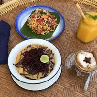 Clockwise - Shan noodles, mango smoothie, Dirty chai latte, Khao Soi  at Free Bird Cafe in Chiang Mai