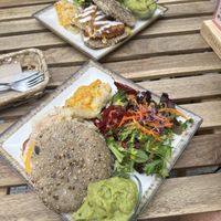 English breakfast (near) & Spanish omelette (far) both with an extra side of scrambled eggs & guac   at Veganitessen in Sevilla