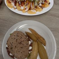Vegan bean burger and nachos  at Veganitessen in Sevilla