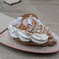 Cream filled croissant with a little Lotus butter on top at Veganitessen in Sevilla