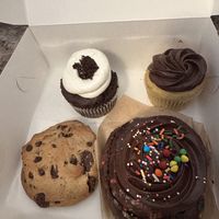 Devils food cupcake, vanilla with chocolate frosting, cosmic brownie bun, and walnut chocolate chip cookie  at For Goodness Cakes - Food Truck in Baiting Hollow
