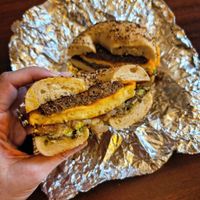 Vegan Just Egg and cheese on an everything bagel with Beyond sausage, hashbrown, and avocado at Roland Park Bagels in Baltimore