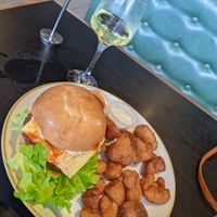 Angove (vegan) wine, vegan chicken snitty burger, vegan cauliflower bites with vegan aioli and chilli sauce. Sooooooo good!  at Burger Urge in Port Macquarie