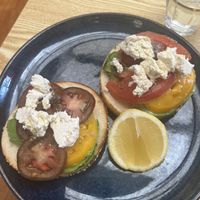 Bagel with avocado, tomatoes and feta  at Oh My Days in Glebe