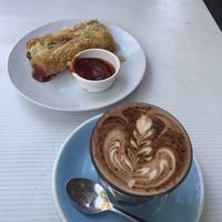 Mocha and “pork” n fennel sausage roll   at Oh My Days in Glebe