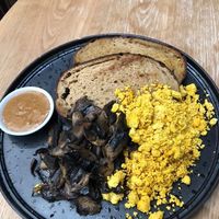 Sourdough toast, with almond butter, scrambled tofu, and mushrooms. at Oh My Days in Glebe