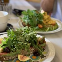 Spinach bun, tomato, avocado ”scrambled eggs” and salad toast.
 at Mama Carmen's Coffee & Bakery in Mallorca