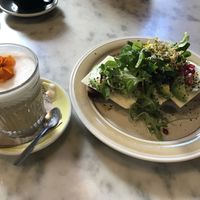 Coffee with oat milk and a vegan toast at Mama Carmen's Coffee & Bakery in Mallorca