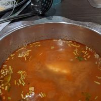 Tom yum broth at K & L 98 HotPot in Boynton Beach
