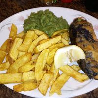 Banana blossom fillet, chips and mushy peas. Very tasty. at The London Fryer in Paignton