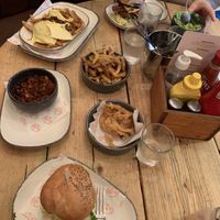 Burgers, fries, beans and onion rings  at Hubbox in Truro