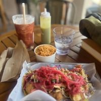 Crazy shrimp tacos and a side of Mexican rice with mild salsa  at Earth Plant Based in Phoenix