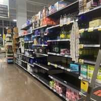 Empty Shelves in the Water Aisle - Liquid Death Spotted $9.99 for Iced Tea  at Whole Foods Market - P St in Washington