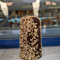 Mango sorbet coated in dark chocolate and hazelnut at 32 Agosto in Paros