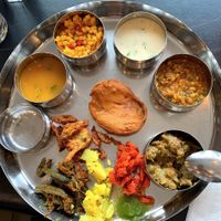 Thali filled with food and they will add more if you want  at Avsar in Mississauga
