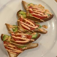 Avocado Toast with Tomato at Olivia's Organic Cafe in Burnsville