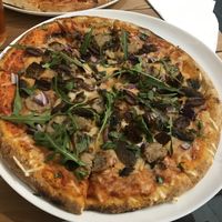 Vegan sausage, vegan cheese, red onion, mushrooms, olives and rocket at The Corner Deli in Porthleven