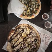 Both have vegan cheese and beyond meat. Top has regular crust wed red sauce and veggies, mine is bbq sauce with pineapple onion garlic, both delicious  at Mod Pizza in Sierra Vista