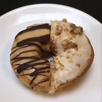 Baby Got Back (peanut butter & dark chocolate) / roasted walnuts  at Boneshaker Doughnuts in Paris