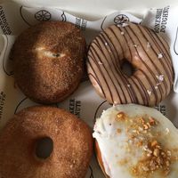 Apple cinnamon / baby got back (peanut butter & dark chocolate) / Beach Heaven (sugar & cinnamon) / Fluffernutter (peanut butter pastry cream) at Boneshaker Doughnuts in Paris