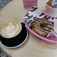 Baby got back donut and coffee latte at Boneshaker Doughnuts in Paris