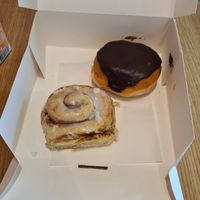Cinnamon roll and cream doughnut at Boneshaker Doughnuts in Paris