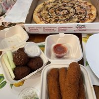 Uncle Buck pizza, jackfruit wings, and mozzarella sticks.  at New Ethic in Rochester