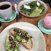 Avocado toast (w/o goat cheese), beetroot latte, bagel with avocado and poached eggs (w/o salmon) at Les Filles in London