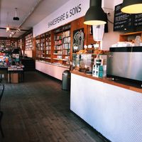 Interior looking towards Shakespeare & Sons book shop and café dining area. at Fine Bagels @ Shakespeare and Sons in Berlin