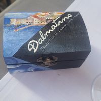 Check is delivered in a cute box at Dalmatino in Dubrovnik
