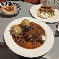 Pita Bread (€ 1,80), Schnitzel (€ 14,50), Seitan Game Ragout (€ 16,20)  at Landia in Vienna