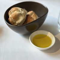 Fresh bread with olive oil   at JOMNO Modern Khmer Cuisine  in Siem Reap