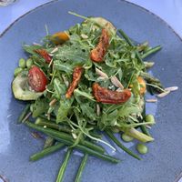 Asparagus salad with beans, arugula, zucchini and tomatoes. Order without cheese for it to be vegan.  at Van der Valk in Goes