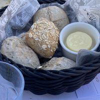 Bread served with the salad, here with non vegan butter because of non vegans at my table. at Van der Valk in Goes