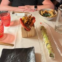 Vegan pulled pork bao, avocado roll, veggie tempura. at Fvsion in Cortina D Ampezzo