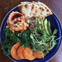 Harmony plate. Warm Kale, hot pita, avocado, walnuts, house made paprika dressing, sprouts, quinoa,  full of color and flavor.  at The Dish in Baton Rouge