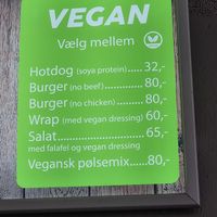 Vegan menu on screen above counter at Iscafeen in Hvide Sande