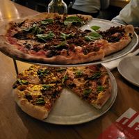 Pizza with vegan cheese and sausage at Delarosa - Chestnut St in San Francisco