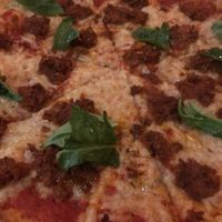 Marghertta with vegan cheese and sausage at Delarosa - Chestnut St in San Francisco