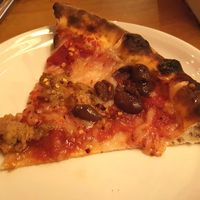 Vegan pizza with cheese and sausage at Delarosa - Chestnut St in San Francisco