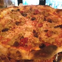 Vegan pizza with cheese and sausage at Delarosa - Chestnut St in San Francisco