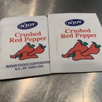 Red pepper flakes  at Jane's Pizzeria in Fountain Valley