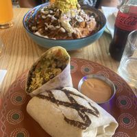 Background - nachos. Foreground - burrito  at Jajaja Mexicana - West Village in New York City
