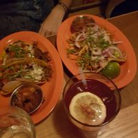 Left: Chorizo tacos; Center: Pomegranate y jalapeño cocktail; Right: Barbacoa tacos at Jajaja Mexicana - West Village in New York City