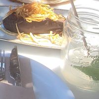 Smoked egg plant salad with string potatoes & mint lemonade with fresh mint, fresh lemon juice, soda and homemade mint syrup at Med Cafe in Crete